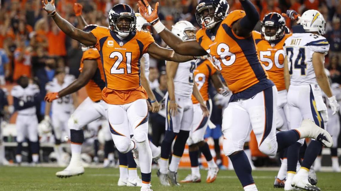 Denver Broncos outside linebacker Shaquil Barrett, cornerback Aqib Talib and inside linebacker Zaire Anderson run off the field with one second left on the clock against the Los Angeles Chargers after a blocked field goal attempt. The Broncos won 24-21.