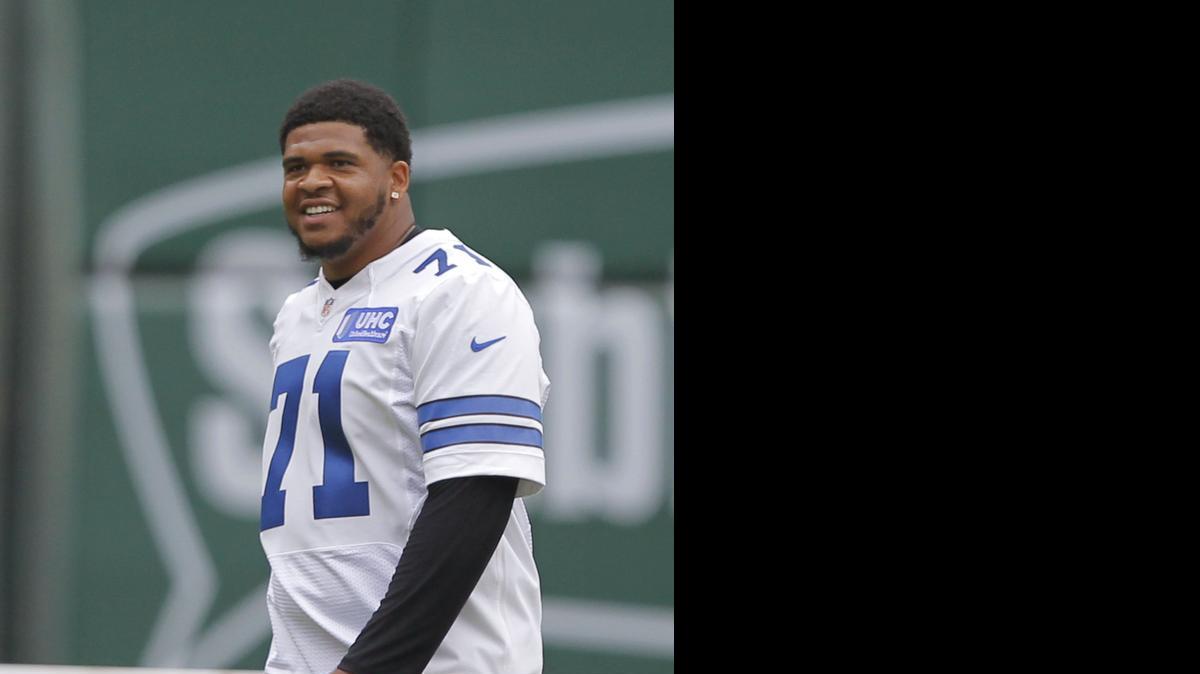 
Rookie offensive lineman La'el Collins plays the outfield as members of the Cowboys compete in the Reliant Home Run Derby to benefit the Salvation Army.
