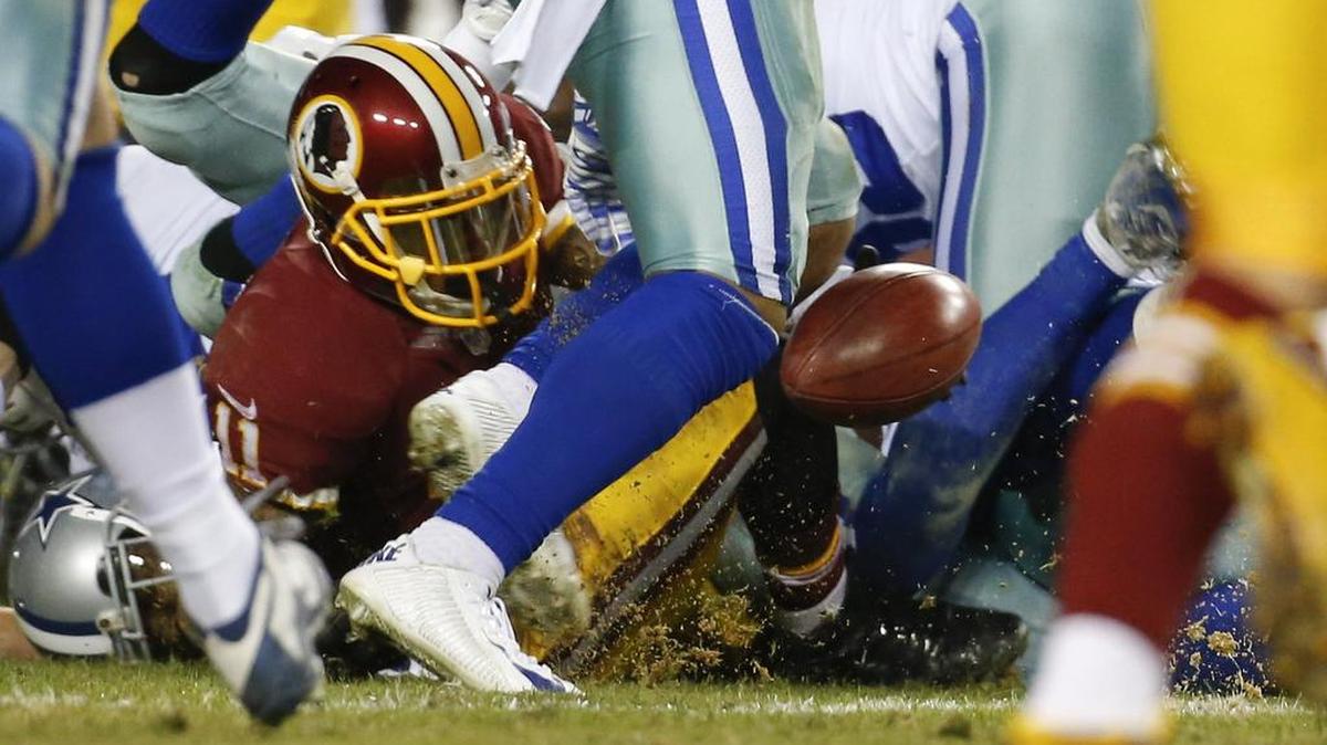 Redskins receiver DeSean Jackson (11) fumbled on a punt return, with Cowboys punter Chris Jones recovering.