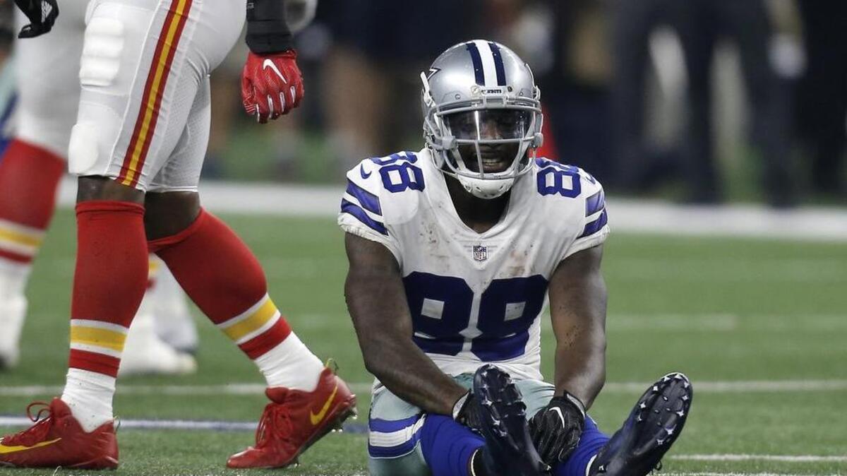 Dallas Cowboys' Dez Bryant (88) lays on the field after dropping a pass. He says the sun is a factor on drops at AT&T Stadium and wants the Cowboys to do something about it.