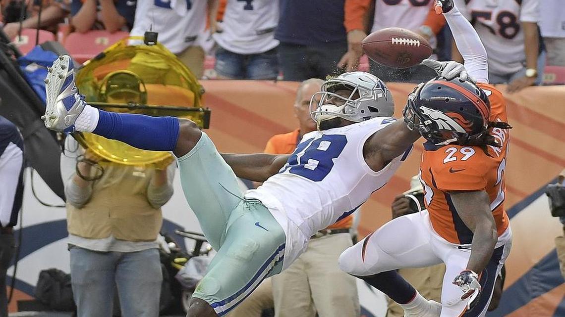 Cowboys wide receiver Dez Bryant, left, can’t come down with a fourth down pass in the end zone in the fourth quarter Sunday during a 42-17 loss to the Denver Broncos.