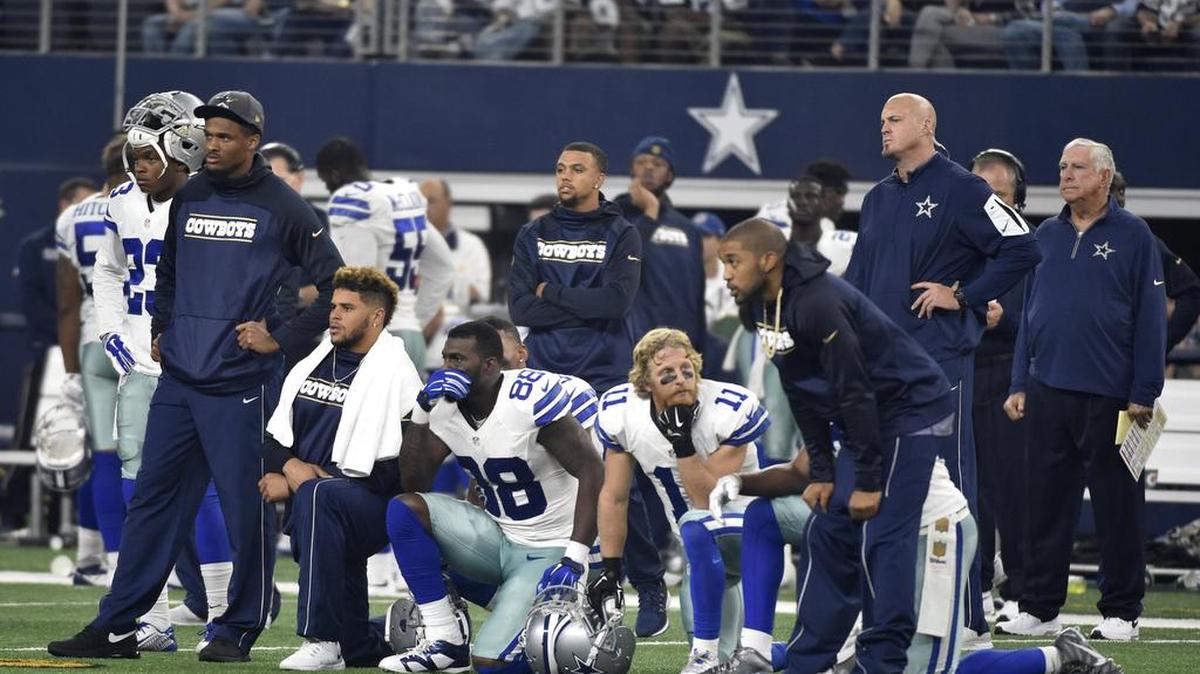 Cowboys players Dez Bryant (88), Cole Beasley (11) and others watch as Seahawks wide receiver Ricardo Lockette is attended to by medical staff Sunday.