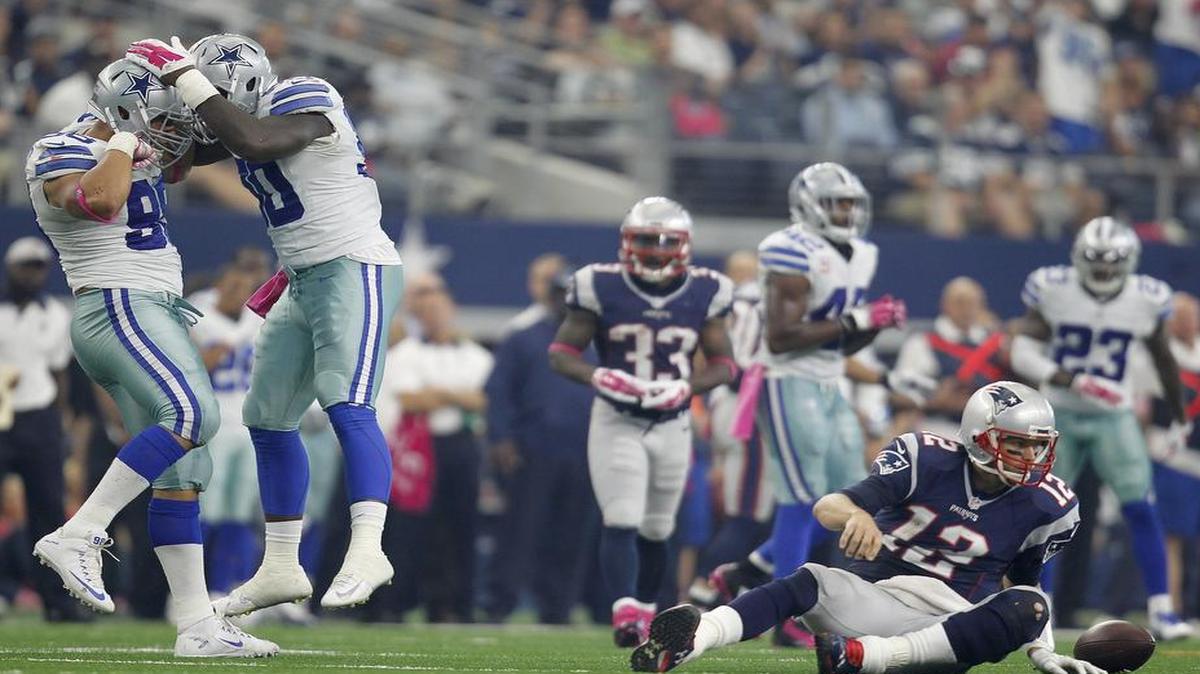 
Tyrone Crawford and DeMarcus Lawrence celebrate after sacking New England quarterback Tom Brady in the second quarter.
