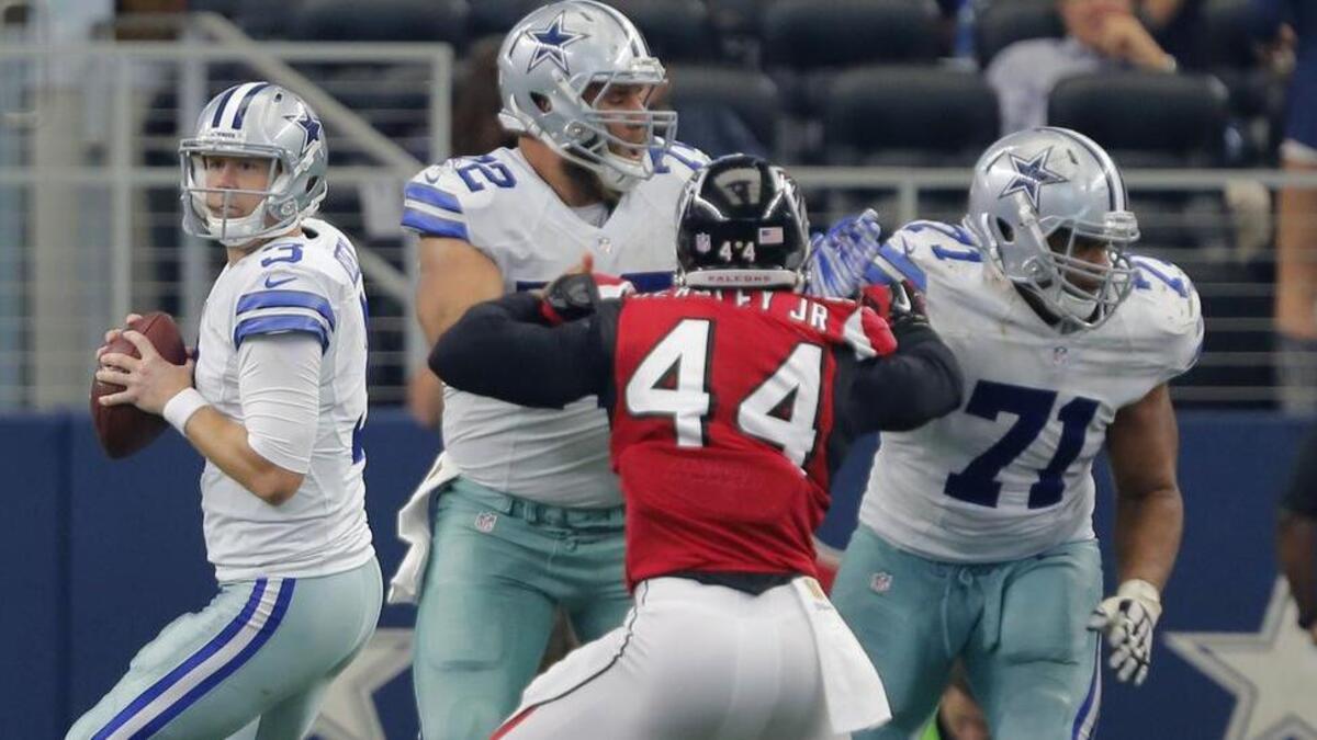 
Center Travis Frederick (72) and left guard La'el Collins (71) helped protect Brandon Weeden, who was sacked twice Sunday.
