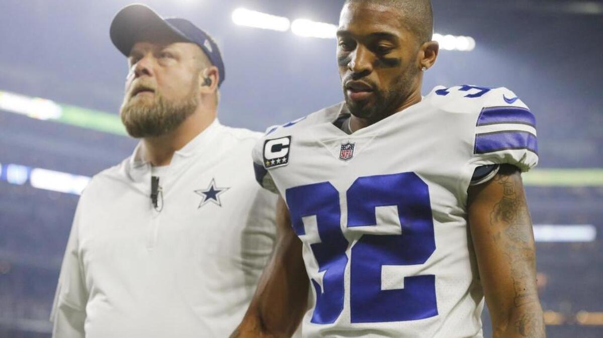 Dallas Cowboys cornerback Orlando Scandrick is escorted off the field to be checked for an injury during the game against the New York Giants in Arlington, Texas September 10, 2017. He suffered a fractured bone in his hand and is set for surgery on Monday.