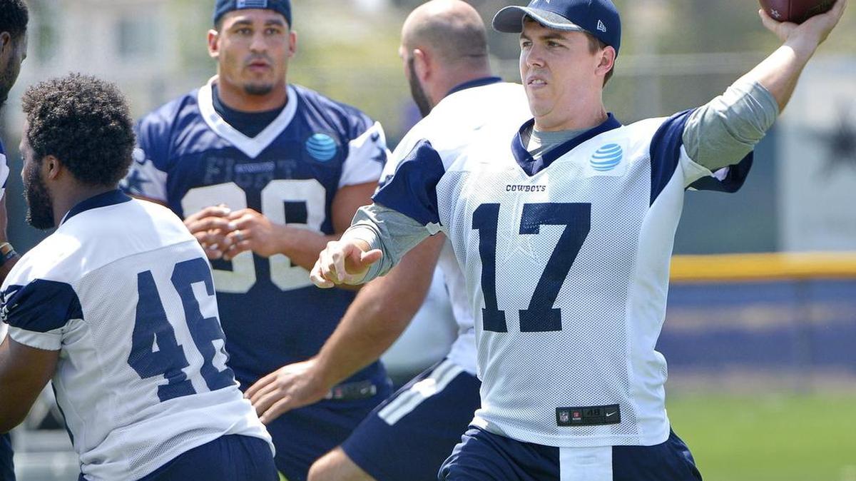Backup quarterback Kellen Moore, above, practiced with the first-team offense Sunday while Tony Romo rested.