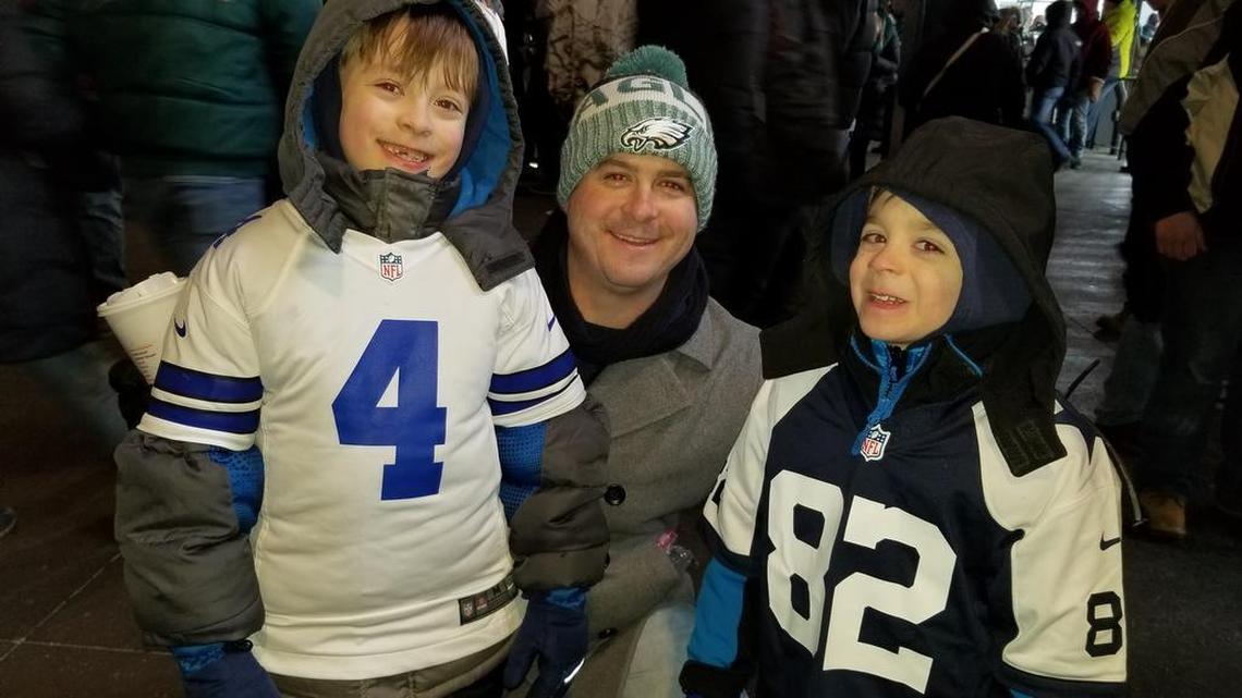 David, 8, and Daniel, 6, grew up Dallas Cowboys fans despite living near Camden, New Jersey. They attended Sunday’s game at Lincoln Financial Field in Philadelphia with their Eagles-loving dad, middle, despite temperatures hovering in the mid-teens.