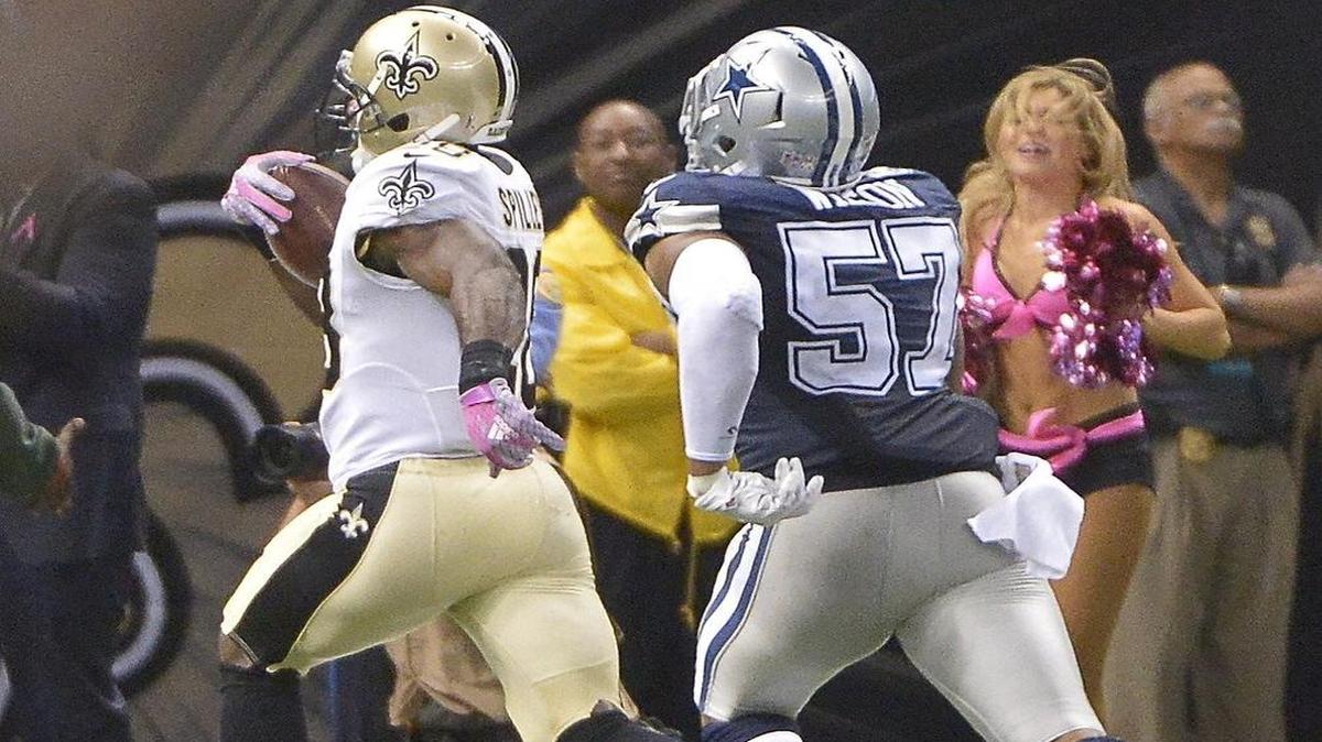 
Cowboys linebacker Damien Wilson (57) chases Saints running back C.J. Spiller (28) on Spiller’s 80-yard touchdown catch in overtime.
