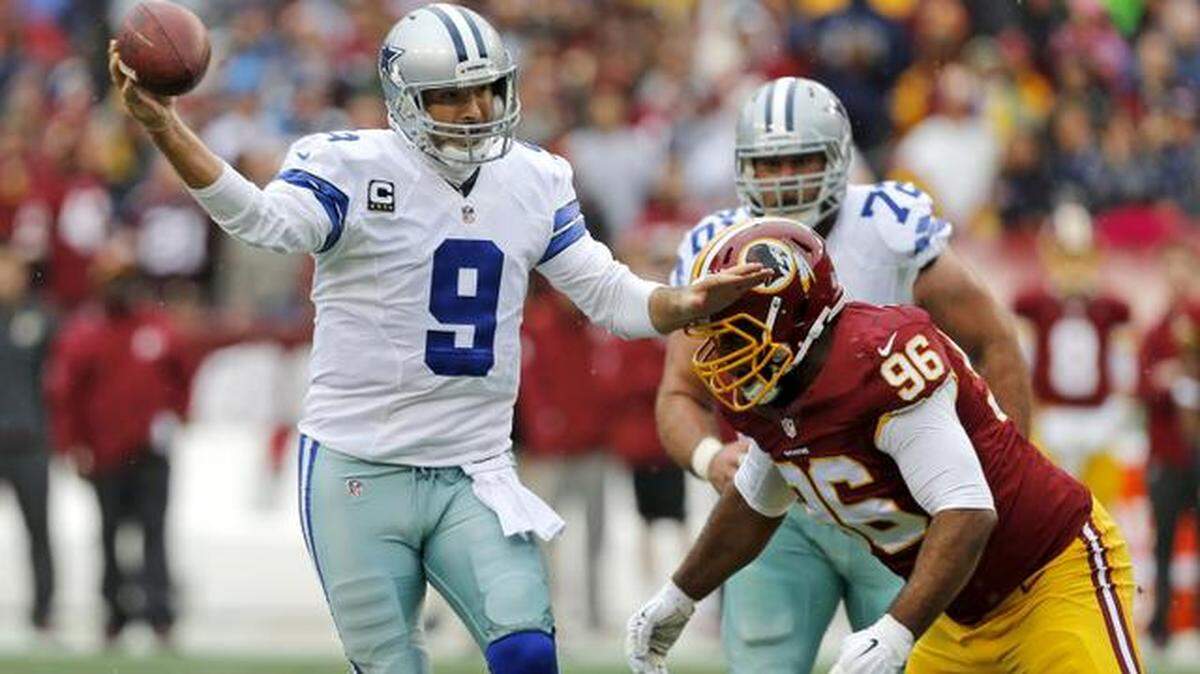
Dallas Cowboys quarterback Tony Romo (9) throws incomplete under pressure from Washington Redskins nose tackle Barry Cofield (96) in the second quarter as the Dallas Cowboys play the Washington Redskins, at FedEx Field in Landover, Maryland, Sunday, December 28, 2014. 
