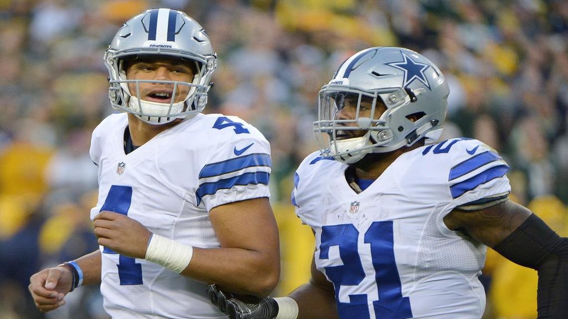 Cowboys quarterback Dak Prescott, left, and running back Ezekiel Elliott teamed up to set more rookie records Sunday. Prescott finally threw an interception after 177 pass attempts, and Elliott has rushed for more than 130 yards in four consecutive games.