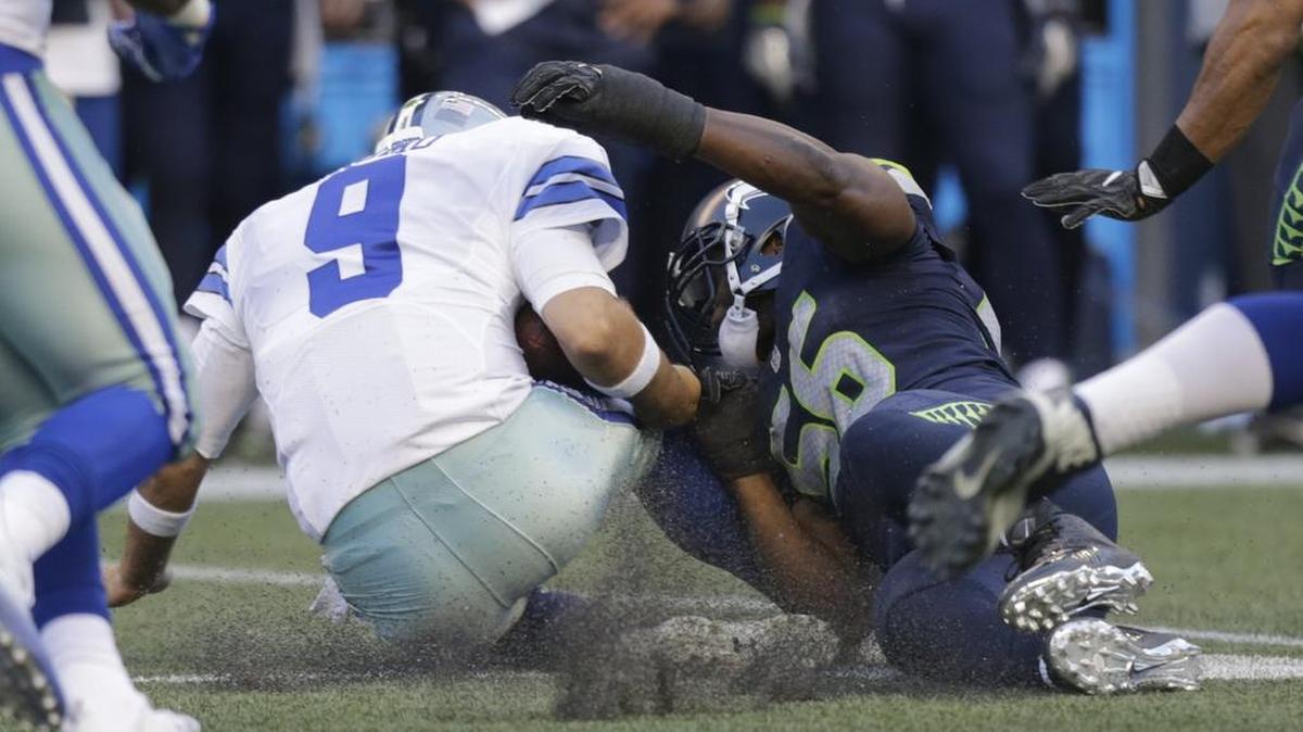 Dallas Cowboys quarterback Tony Romo (9) could miss the first eight games of the season with a fractured bone in his back.