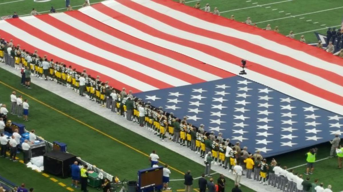 Green Bay Packers players linked arms during the national anthem before Sunday’s game against the Dallas Cowboys at AT&T Stadium in Arlington.