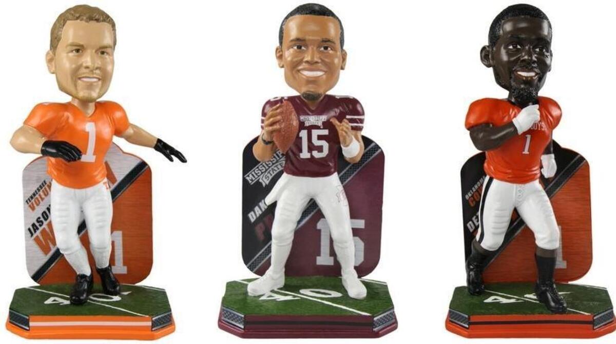 Bobbleheads of Dallas Cowboys’ stars Jason Witten, left, Dak Prescott and Dez Bryant are new to the National Bobblehead Hall of Fame and Museum store.