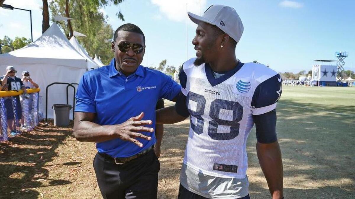 Former Cowboy, Hall of Famer and broadcaster Michael Irvin with wide receiver Dez Bryant at the Cowboys afternoon practice at their 2015 training camp in Oxnard, California.