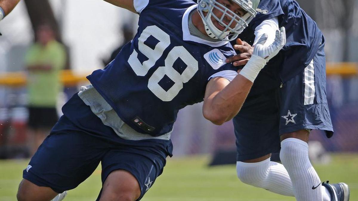 
Dallas Cowboys defensive tackle Tyrone Crawford (98) cuts around defensive tackle coach Leon Lett during a recent practice. 
