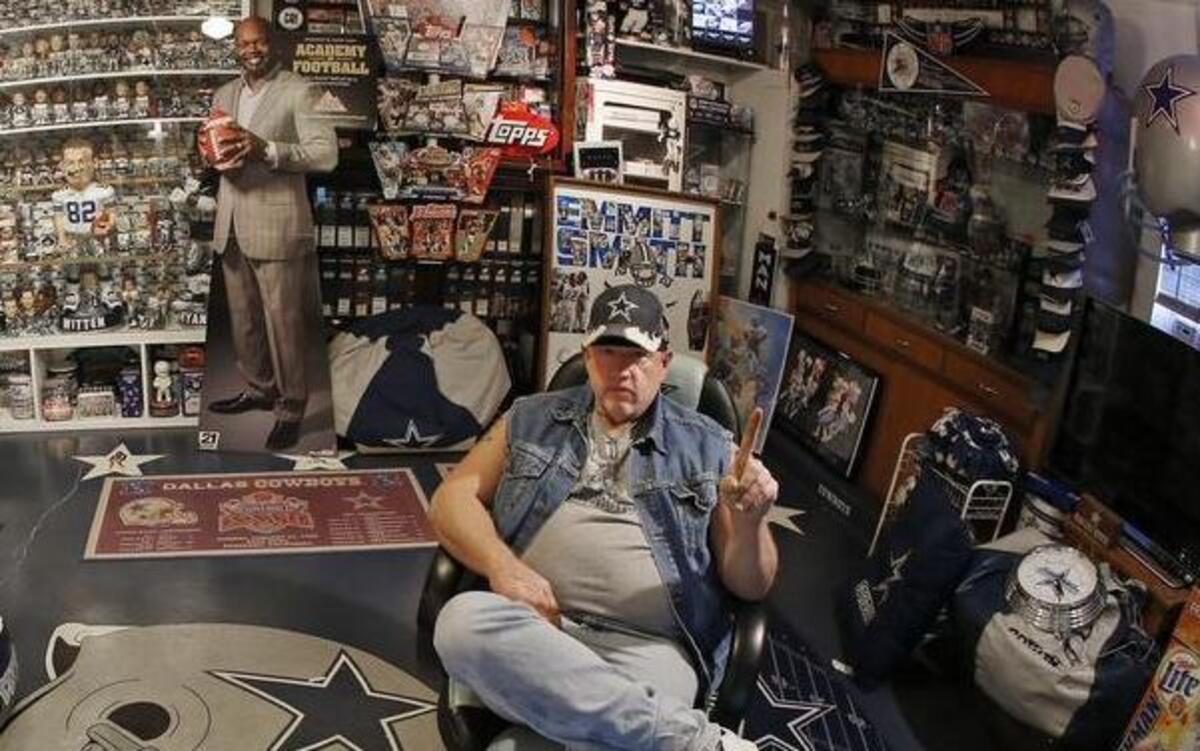 Stoney Kersh, sitting in his den, has turned his house, garage and cars into a Dallas Cowboys museum.
