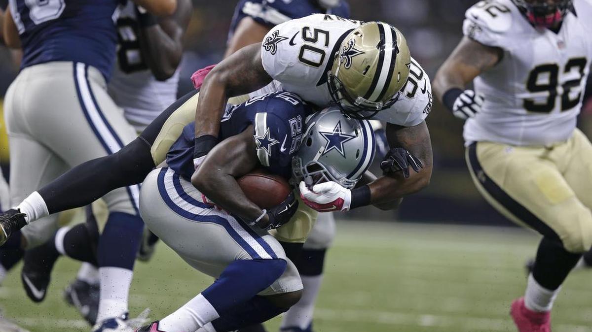 
Lance Dunbar (25) had 54 rushing yards before leaving with a knee injury on the second-half kickoff.
