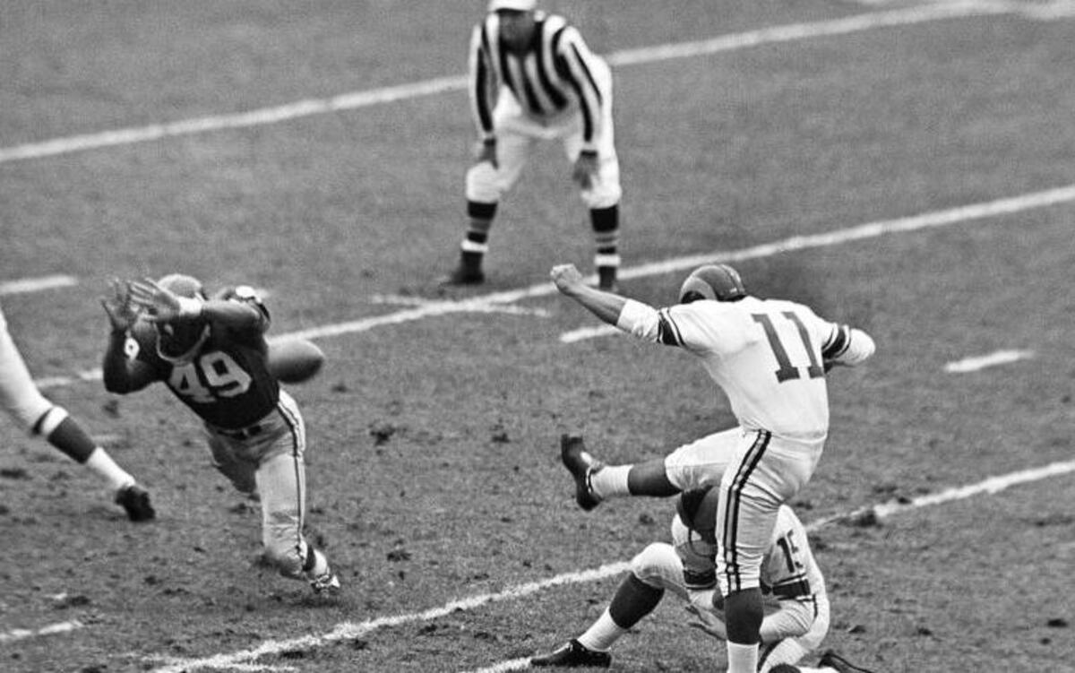 
In this Oct. 22, 1961, photo, New York Giants halfback Erich Barnes (49) blocks a field goal-attempt by Los Angeles Rams' Danny Villanueva (11) at Yankee Stadium. Villanueva, who was one of the NFL’s first Latino kickers and a pioneer of Spanish-language television, has died. He was 77. 
