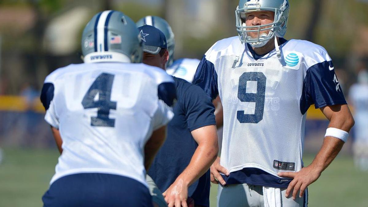 Quarterback Tony Romo, right, watches Cowboys rookie quarterback Dak Prescott (4) work at practice. Prescott and Jameill Showers will play a lot on Saturday.