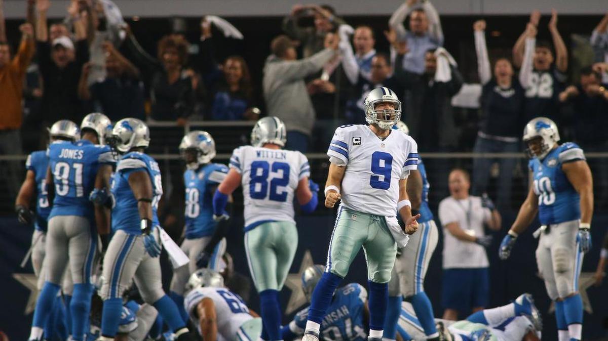 Tony Romo reacts after running back DeMarco Murray scores a third quarter touchdown as the Dallas Cowboys beat the Detroit Lions 24-20 in a playoff game in Arlington on January 4, 2015.