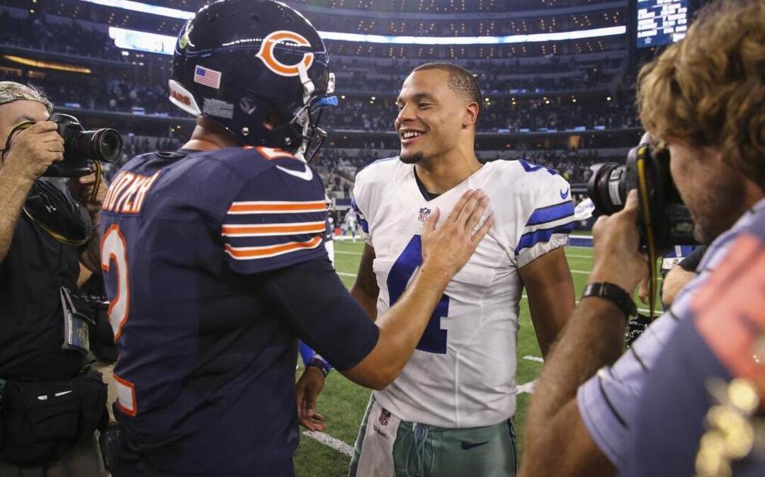 Chicago Bears quarterback Brian Hoyer and Dallas Cowboys quarterback Dak Prescott meet after the Cowboys’ 31-17 win at AT&T Stadium Sunday.