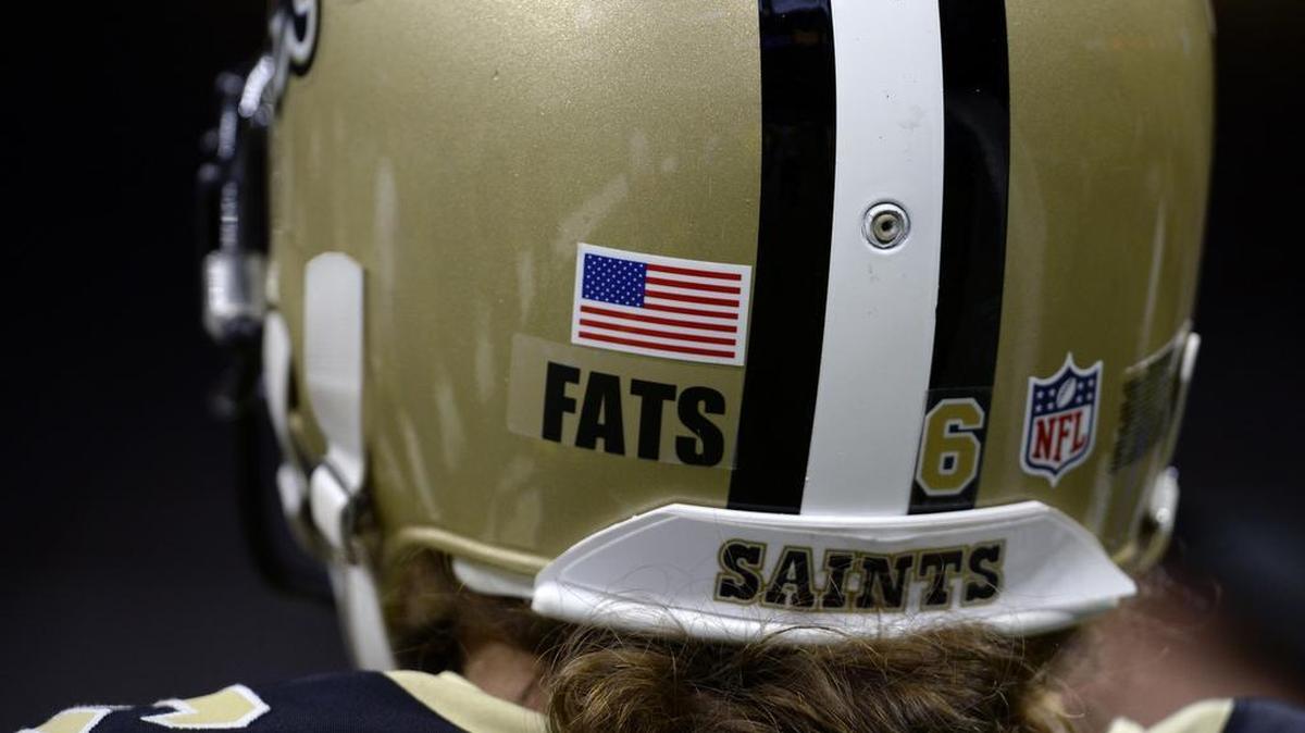 A sticker honoring the the late musical legend Fats Domino, a New Orleans native who died earlier this week, was worn on the back of Saints’ helmets for their game against the Bears on Sunday.