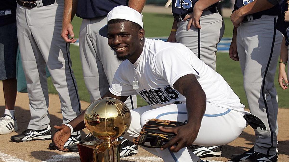 
In 2011, Dez Bryant stole the spotlight as he knelt down by the Larry O’Brien NBA Championship trophy belonging to the Dallas Mavericks during the Heroes Celebrity Baseball Game played at Dr. Pepper Ballpark in Frisco.
