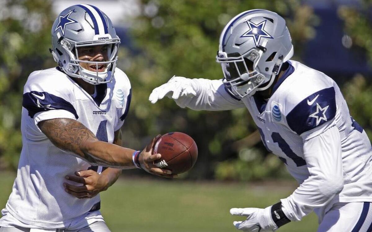 Rookies Dak Prescott, left, and running back Ezekiel Elliott have helped the Cowboys get back to a balanced offensive attack that has run 140 times and attempted 137 passes.
