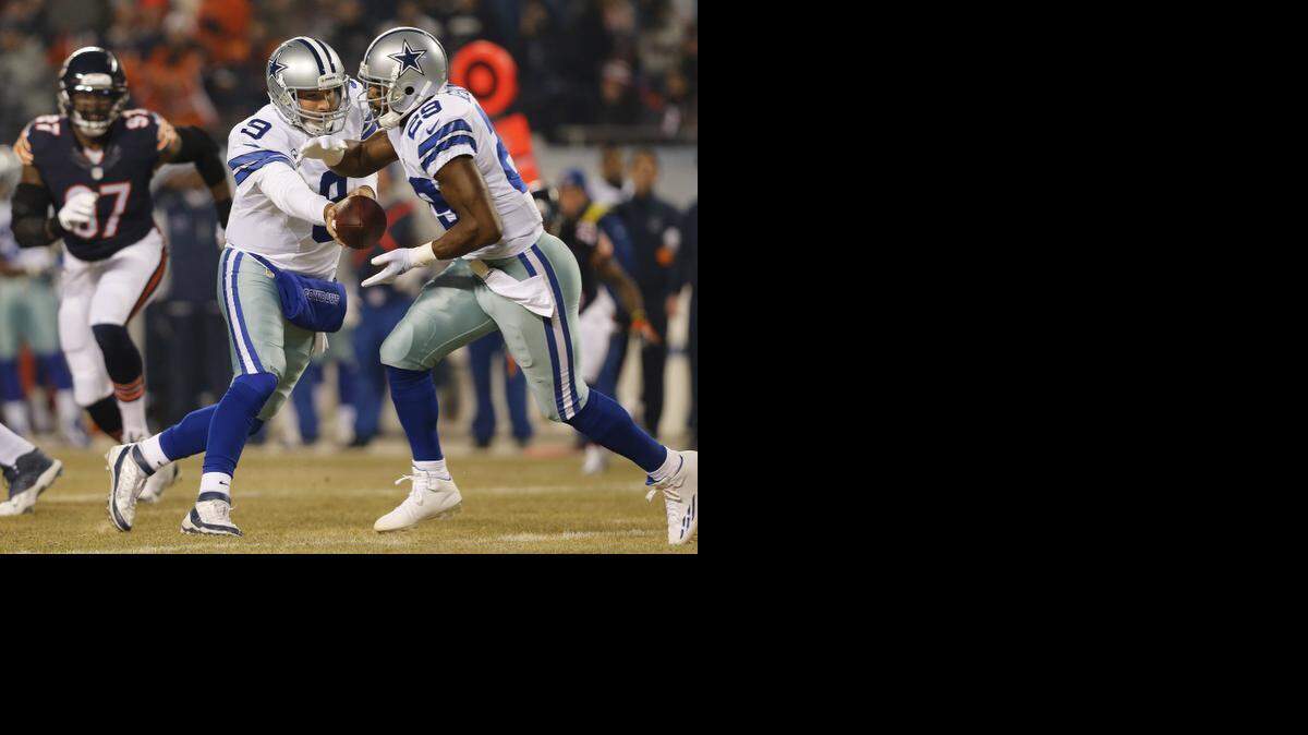 
Dallas Cowboys quarterback Tony Romo and DeMarco Murray had the running game going in full gear against Chicago Thursday night.
