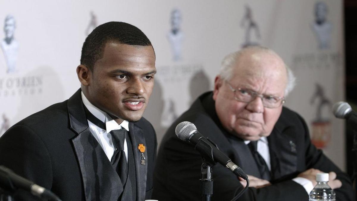 The Davey O’Brien Award to college football's top quarterback was presented to Deshaun Watson, left, from Clemson. The Charles Ringler Founder’s Award winner Verne Lundquist is at right.