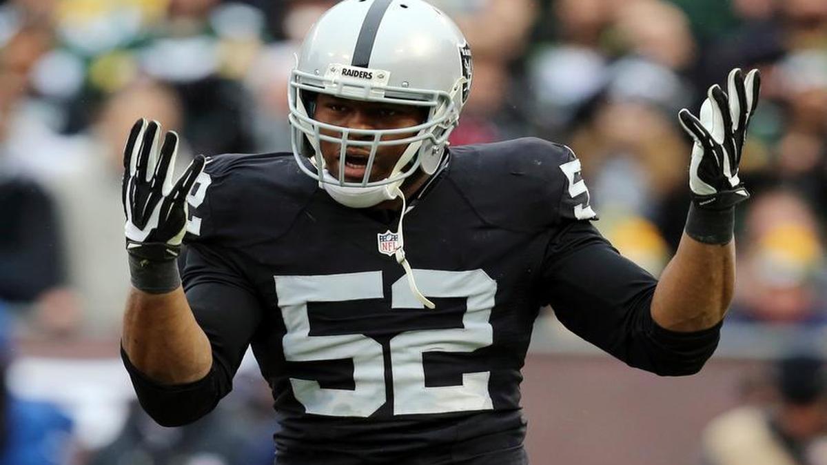 Oakland Raiders defensive end Khalil Mack (52) celebrates after sacking Green Bay Packers quarterback Aaron Rodgers. Khalil Mack has become the first selection at two positions in the same year, while Adrian Peterson and J.J. Watt are unanimous choices for the 2015 Associated Press NFL All-Pro Team.