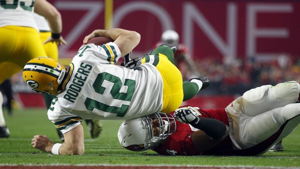 Packers quarterback Aaron Rodgers watched much of the first meeting with the Cardinals from this position. He’ll need to change his perspective to have a chance against Arizona in Saturday’s playoff.