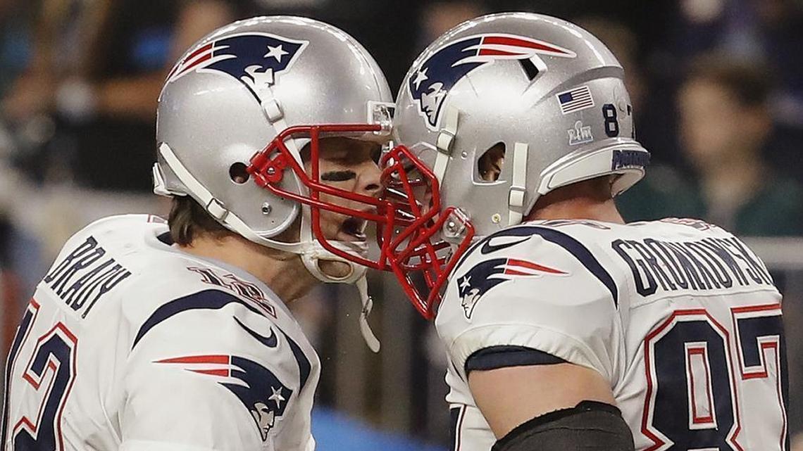Patriots quarterback Tom Brady, left, and tight end Rob Gronkowski celebrate a touchdown in the third quarter of Super Bowl 52.