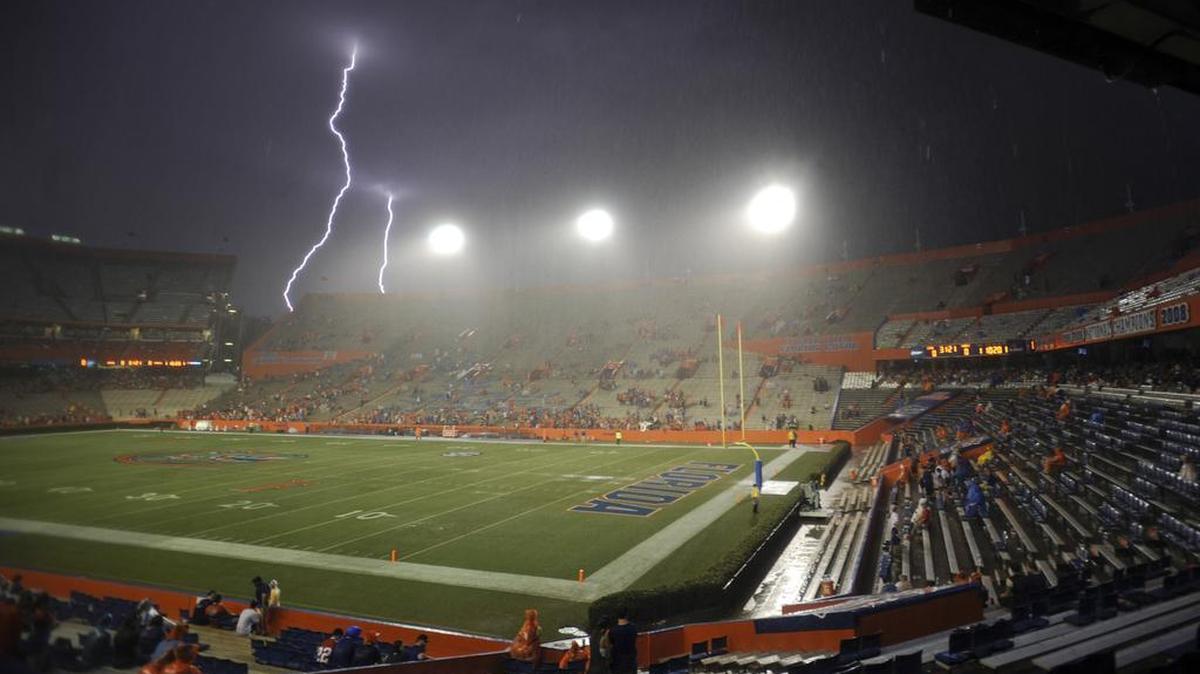 
Lightning strikes near Ben Hill Griffin Stadium at Florida Field during a weather delay before the start of a game between Florida and Idaho in Gainesville on August 30, 2014.
