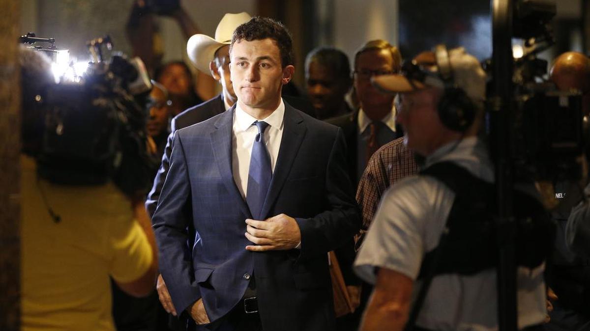 Former Texas A&M and Cleveland Browns quarterback Johnny Manziel reported to court May 5 after a Dallas County grand jury indicted him on a misdemeanor domestic violence charge.