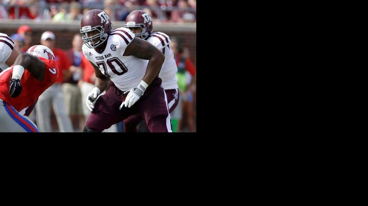 
Cedric Ogbuehi, right, who tore an anterior cruciate ligament in the Aggies’ bowl game, could collect on a loss of value insurance policy if he drops into the second round of the NFL Draft.


