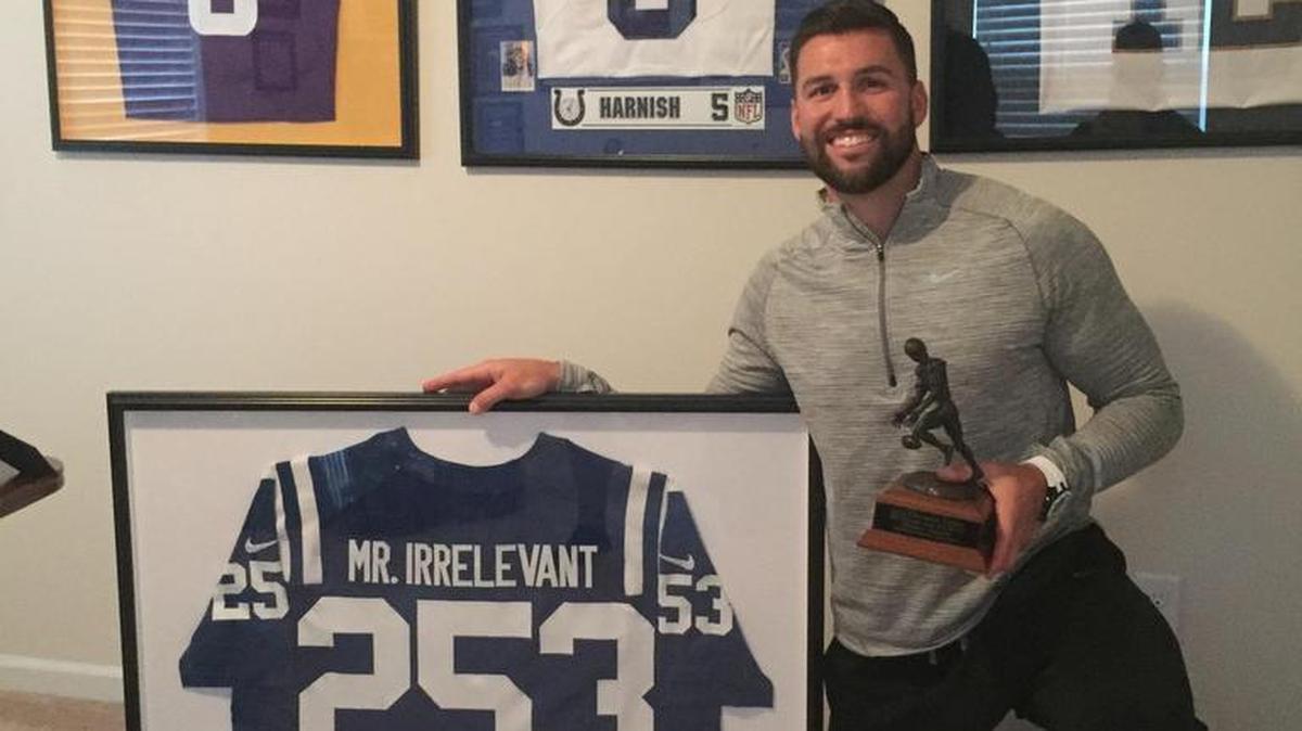 Chandler Harnish, Mr. Irrelevant 2012, is proud of the so-called honor and the Lowsman Trophy. He stuck around in the NFL for three seasons.