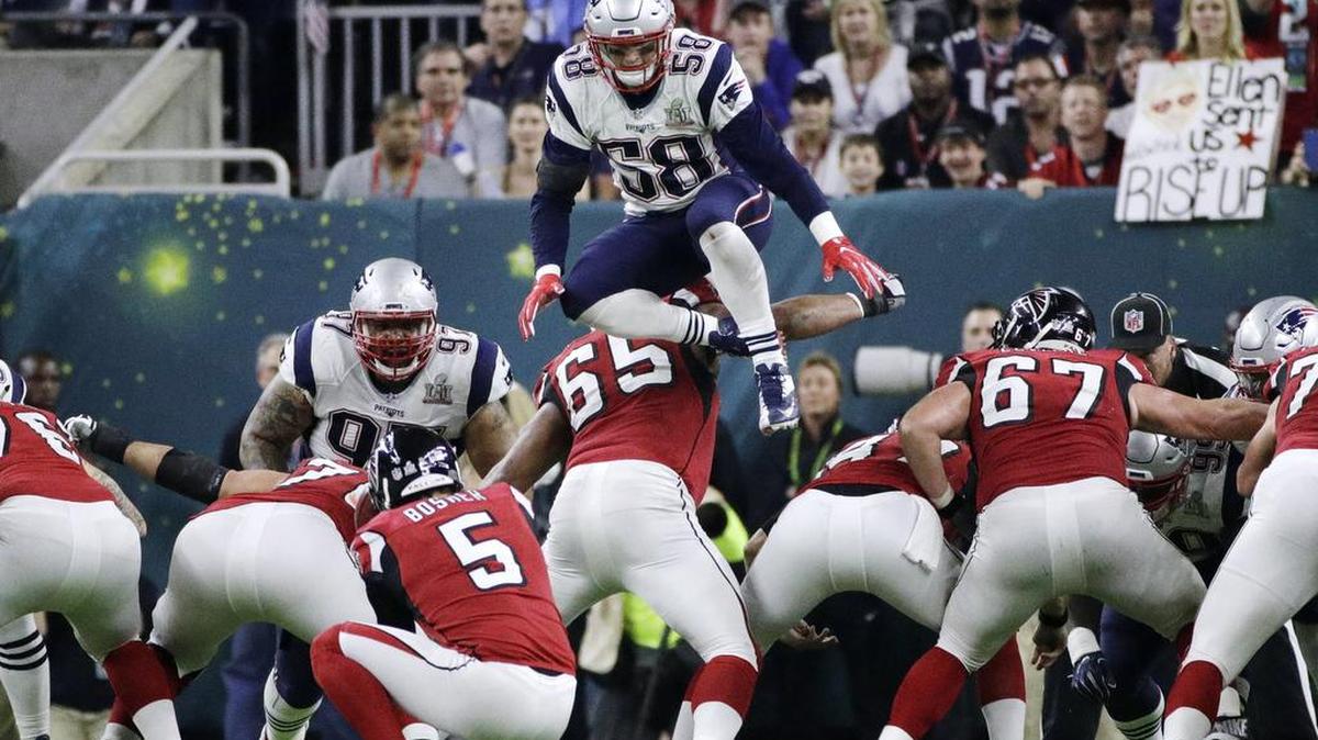 Moves like this one by England Patriots' Shea McClellin, leaping over the line, is no longer allowed on field goals and extra points in the NFL.