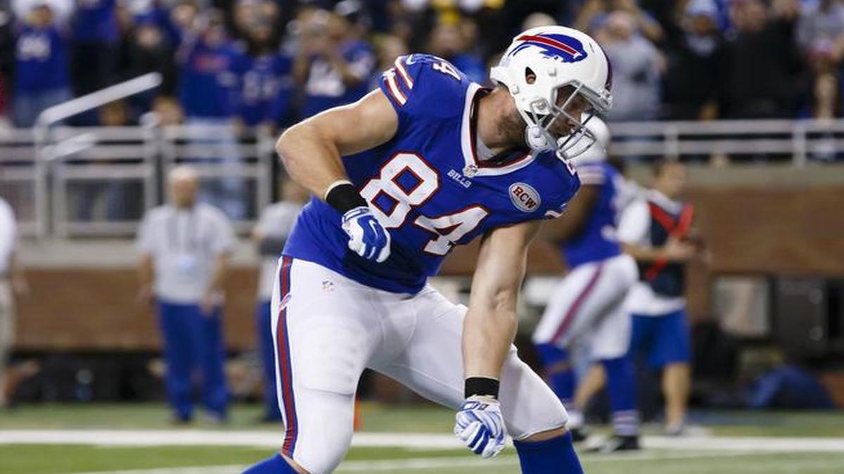 Buffalo Bills tight end Scott Chandler (84) celebrates his touchdown with a “snow shovel” move against the New York Jets at Ford Field in Detroit on Nov. 24, 2014. The Bills game had to be moved because of a snowstorm.