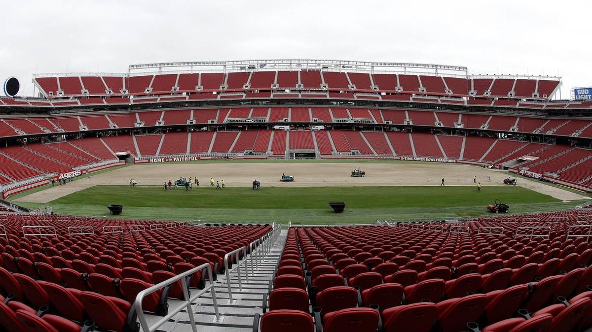 Workers install sod at Levi’s Stadium in San Francisco, home of the 49ers, to prepare for Super Bowl 50.