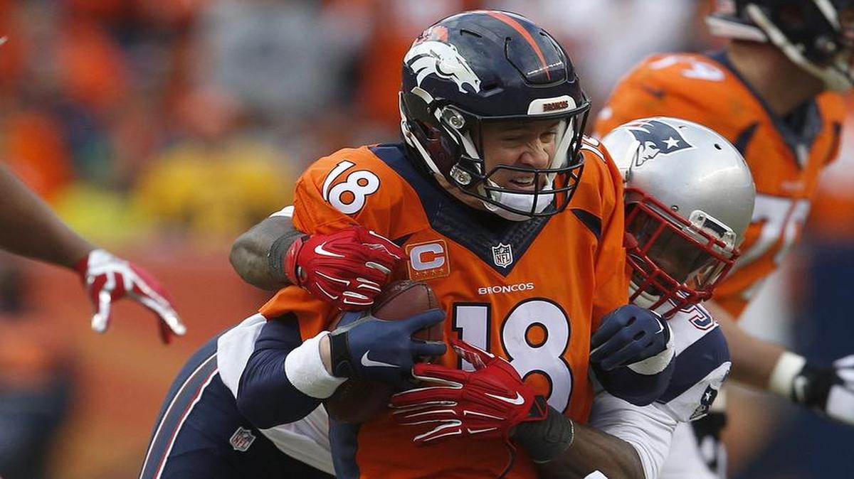 Broncos quarterback Peyton Manning showed his toughness Sunday against the Patriots, scrambling for a first down and making key plays in the clutch.