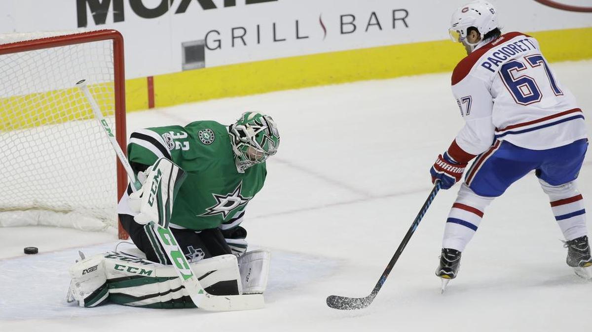Montreal Canadiens left wing Max Pacioretty, right, scores the game-winning goal in overtime against Dallas Stars goalie Kari Lehtonen on Wednesday in Dallas.