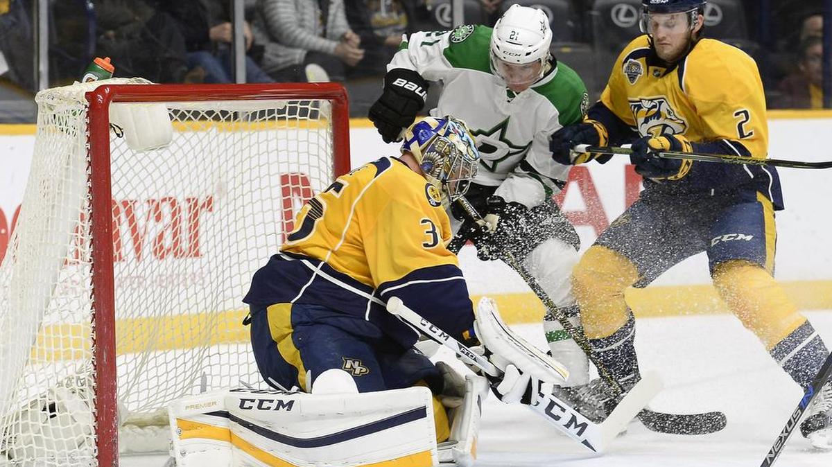The Stars’ Antoine Rousell scores on Predators goalie Pekka Rinne to tie the score 1-1 in the first period Tuesday.