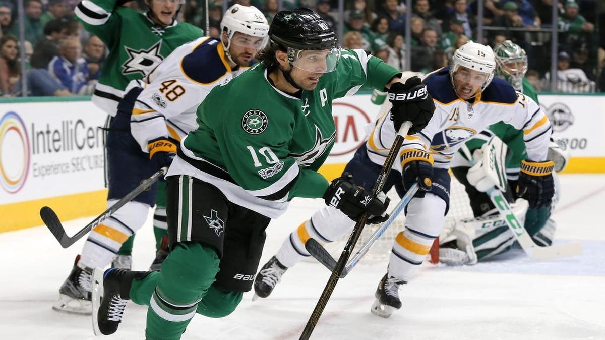 Dallas Stars left wing Patrick Sharp (10) takes control of the puck in front of Buffalo Sabres’ William Carrier (48) and Cal O’Reilly (19) during the second period.