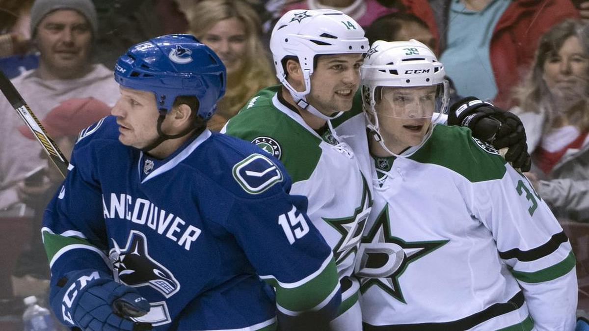 Stars teammates Lauri Korpikoski, middle, and Jamie Benn will get another shot at Derek Dorsett, left, and the Vancouver Canucks at 7:30 p.m. Friday in Dallas. Vancouver won the first meeting 5-4 in overtime on Nov. 13.
