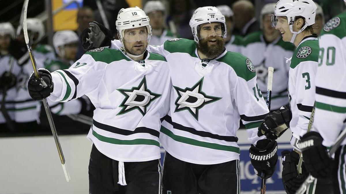 Stars forward Patrick Sharp, left, celebrates his goal with teammates Patrick Eaves, center, and John Klingberg (3) during the second period Saturday against the San Jose Sharks. Dallas won 4-2.