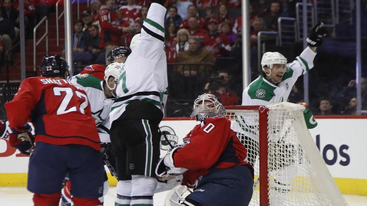 Dallas Stars center Devin Shore, center, celebrates his first-period goalw ith score with teammate Patrick Sharp during the first period Monday.