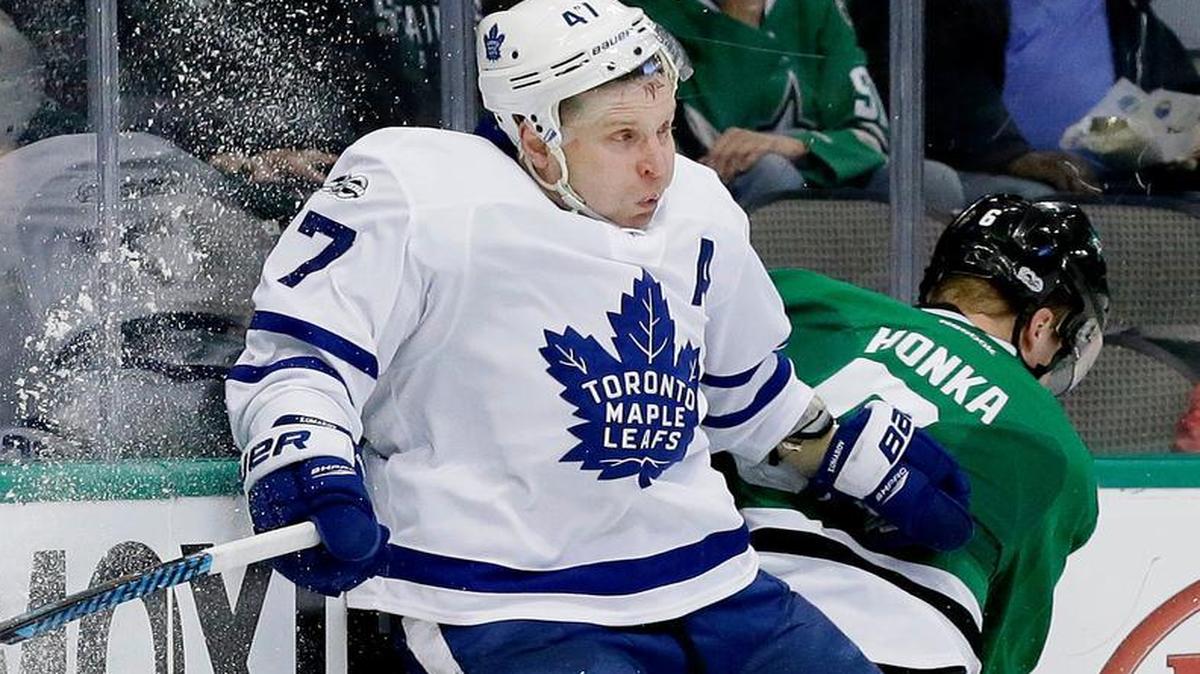Toronto Maple Leafs center Leo Komarov (47) hits the boards next to Dallas Stars defenseman Julius Honka (6) during the second period in Dallas on Tuesday, Jan. 31.