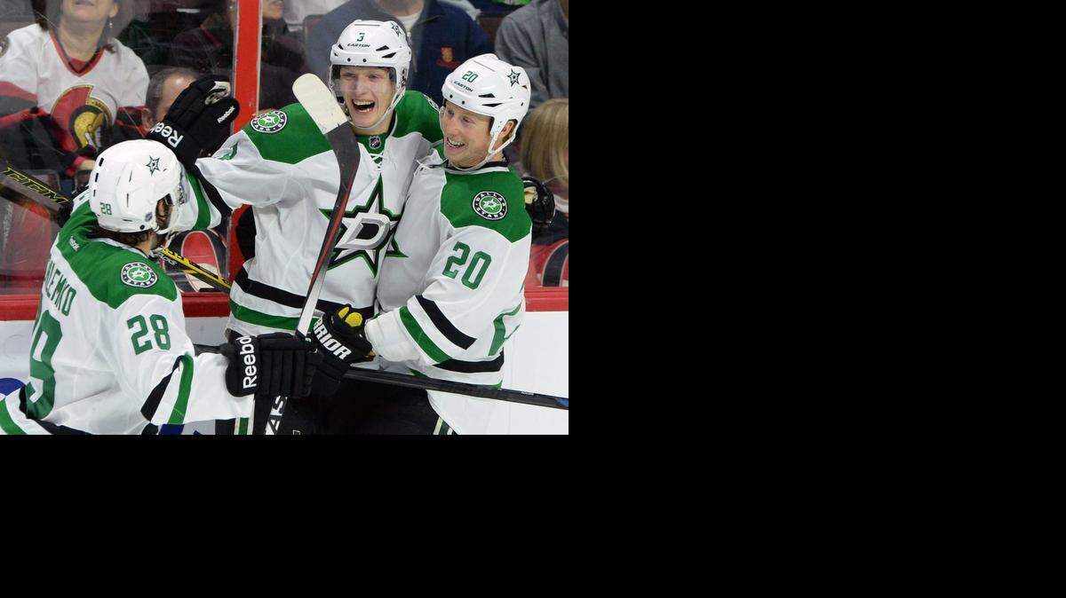 
Stars rookie defenseman John Klingberg, center, and teammates celebrate his go-ahead goal in the third period.
