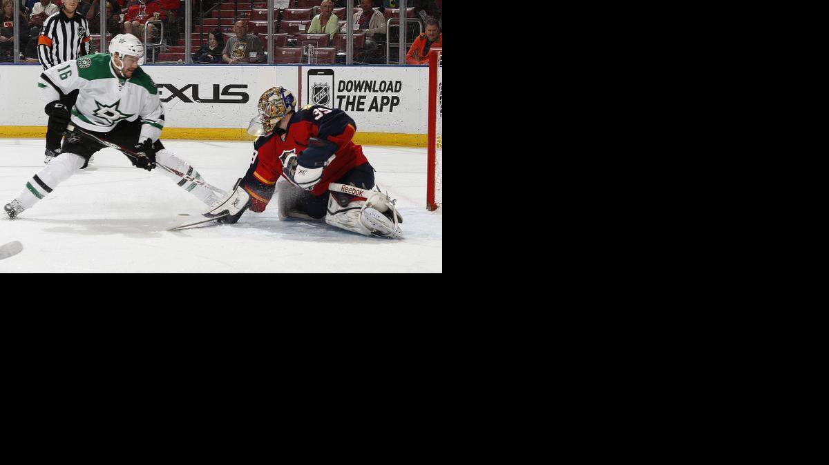 
Panthers goaltender Dan Ellis stops a shot by the Stars’ Ryan Garbutt during the first period.
